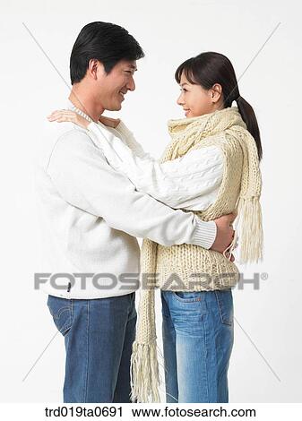 Stock Image - daytime, oriental, muffler, smile, couple, person. Fotosearch