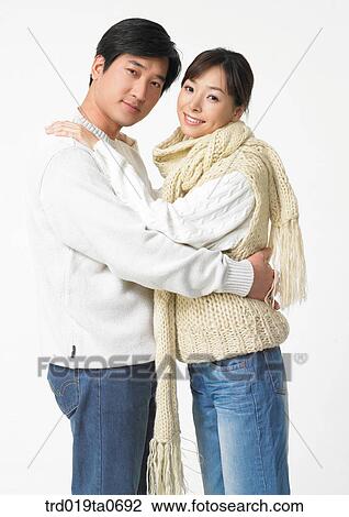 Stock Image - daytime, oriental, muffler, smile, couple, person. Fotosearch