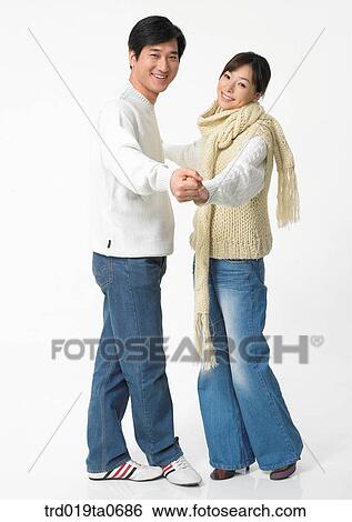 Stock Photograph - daytime, oriental, muffler, smile, couple, person. Fotosearch