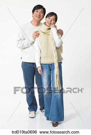 Stock Photograph - daytime, oriental, muffler, smile, couple, person. Fotosearch