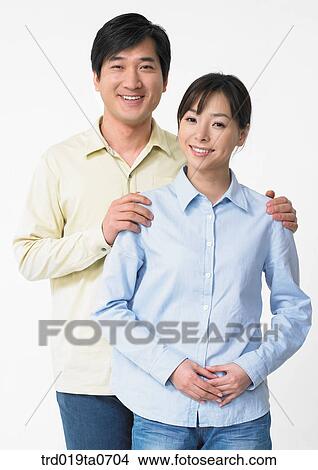 daytime, oriental, smile, couple, person, indoor View Large Photo Image Picture - daytime, oriental, smile, couple, person, indoor. Fotosearch