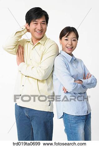 Stock Photo - daytime, oriental, smile, couple, person, indoor. Fotosearch