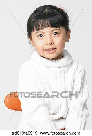 Stock Photo - daytime, oriental, smile, person, indoor, child, woman. Fotosearch