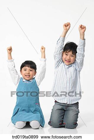 Stock Photo - family, brother and sister, daytime, oriental, smile, punishment, person. Fotosearch