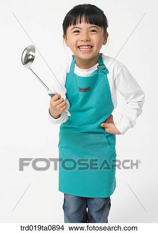 Picture - ladle, daytime, oriental, smile, person, indoor, apron. Fotosearch