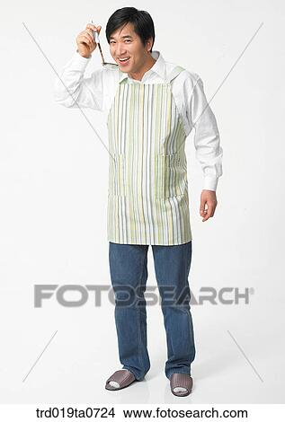 Picture - pair of rubber gloves, ladle, daytime, oriental, person, indoor. Fotosearch