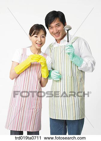 pair of rubber gloves, ladle, daytime, oriental, couple, person View Large Photo Image Stock Image - pair of rubber gloves, ladle, daytime, oriental, couple, person. Fotosearch