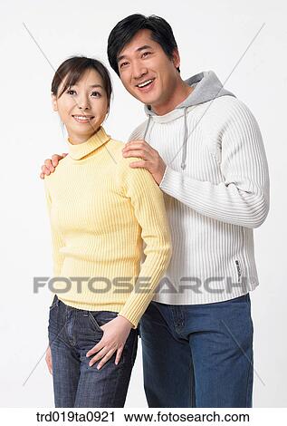 Stock Image - woman, daytime, oriental, smile, couple, person. Fotosearch