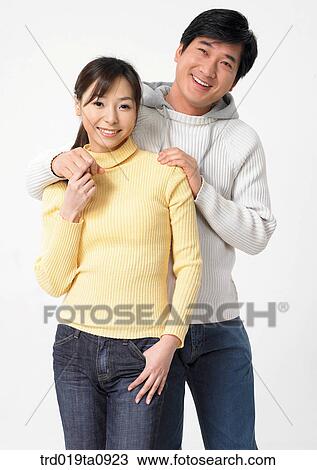 Stock Image - woman, daytime, oriental, smile, couple, person. Fotosearch