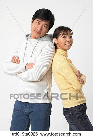 Stock Photograph - woman, daytime, oriental, smile, couple, person. Fotosearch