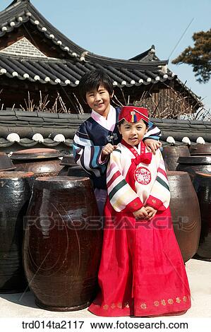 Stock Photo - festival day, New Year's Day, Korean clothes, tradition, clothes, harvest festival, outdoor. Fotosearch