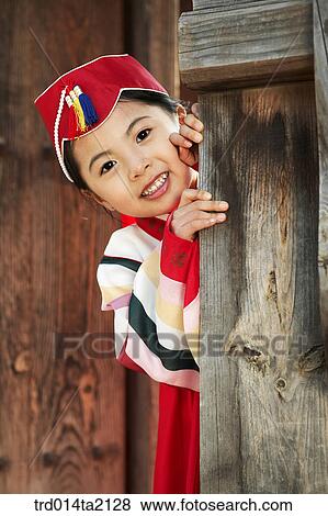 Stock Photo - festival day, New Year's Day, Korean clothes, tradition, clothes, harvest festival, outdoor. Fotosearch