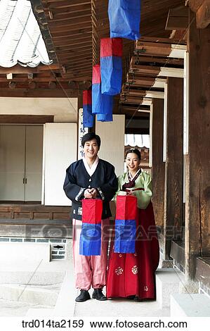 Stock Photo - festival day, New Year's Day, Korean clothes, tradition, clothes, harvest festival, outdoor. Fotosearch