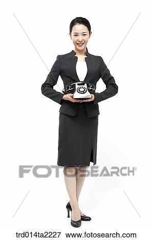Stock Photo - person, oriental, Korean, Asian, woman, indoor, daytime. Fotosearch