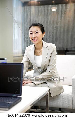 Stock Photograph - person, oriental, Korean, Asian, woman, indoor, daytime. Fotosearch