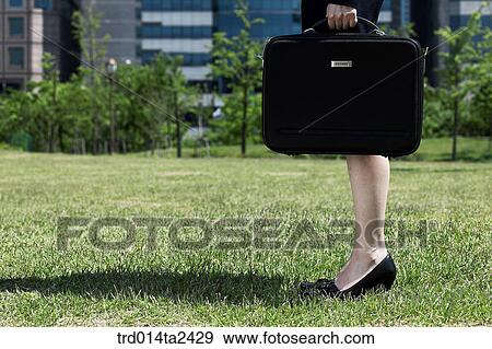 Stock Photo - body, legdocuments bag, person, oriental, Korean, Asian, woman. Fotosearch