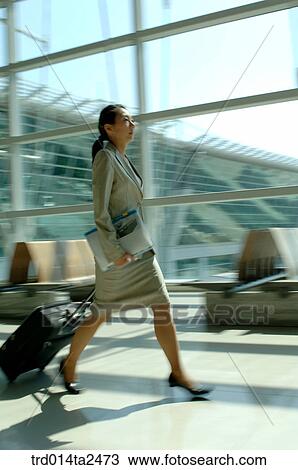 Stock Image - business trip, airport, tourbag, activity, person, oriental, Korean. Fotosearch