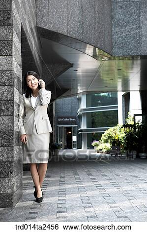 Stock Photograph - construction, building, conversation, person, oriental, Korean, Asian. Fotosearch
