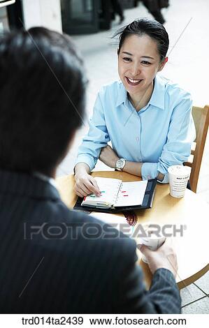 Stock Photo - conversation, associate, person, oriental, Korean, Asian. Fotosearch