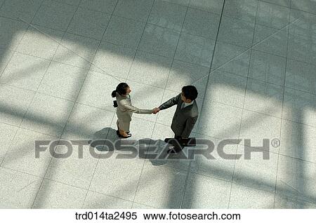 Stock Photography - corridor, handshake, associate, person, oriental, Korean, Asian. Fotosearch