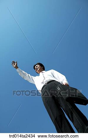 Picture - gesturedocuments bag, person, oriental, Korean, Asian, outdoor. Fotosearch