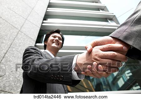 Stock Photograph - handshake, trade, associate, body, handperson, oriental, Korean. Fotosearch