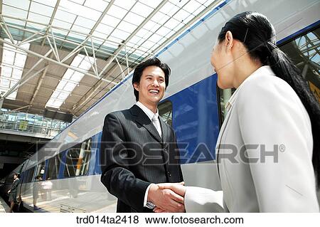 Stock Photo - handshake, trade, associate, person, oriental, Korean, Asian. Fotosearch