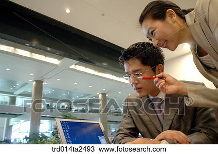 Stock Image - Korean, conversation, oriental, person, notebook, associate. Fotosearch