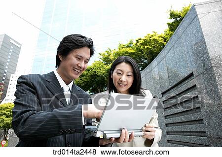 Stock Photo - Korean, conversation, oriental, person, notebook, Asian, associate. Fotosearch