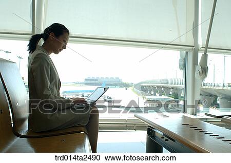 Stock Image - Korean, trainstation, oriental, person, notebook, Asian, airport. Fotosearch