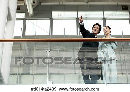 Stock Photo - railing, conversation, gesturecorridor, associate, person, oriental, Korean. Fotosearch