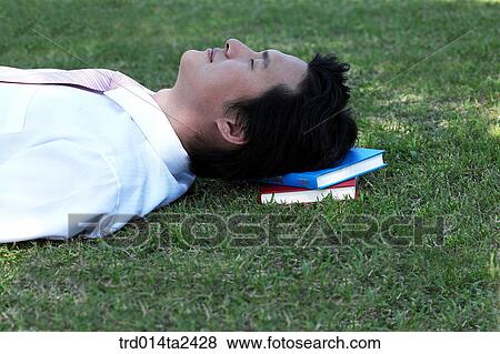 Stock Photo - rest, lawn, person, oriental, Korean, Asian. Fotosearch