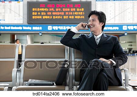 Stock Photograph - station, trainstation, conversation, person, oriental, Korean, Asian. Fotosearch