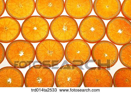 Stock Image - food, fruit, orange, background, close up, arrangement, cut in half. Fotosearch