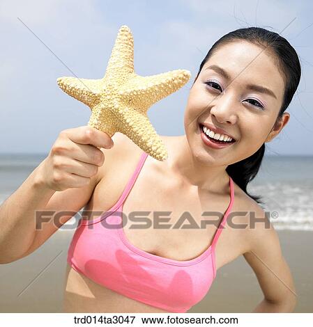 Stock Photo - starfish, gesture, posture, person, Korean, summering, vacation. Fotosearch