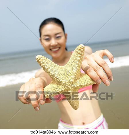 Stock Photography - starfish, gesture, posture, person, Korean, summering, vacation. Fotosearch