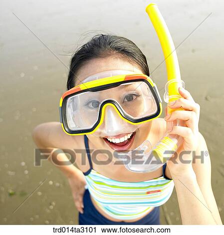 Stock Image - swimming goggles, dabbling, foreshore, gesture, action, posture, person. Fotosearch
