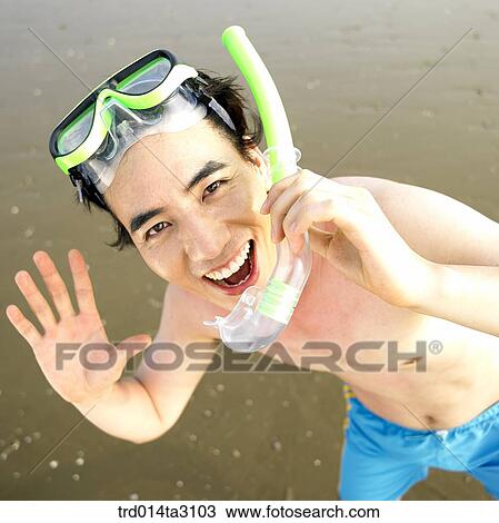 Stock Image - swimming goggles, dabbling, foreshore, gesture, action, posture, person. Fotosearch