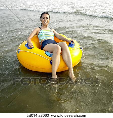 tube, wave, person, Korean, summering, vacation, Oriental View Large Photo Image Stock Image - tube, wave, person, Korean, summering, vacation, Oriental. Fotosearch