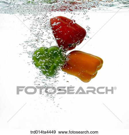 Many green peppers in water View Large Photo Image Stock Photo - Many green peppers in water. Fotosearch