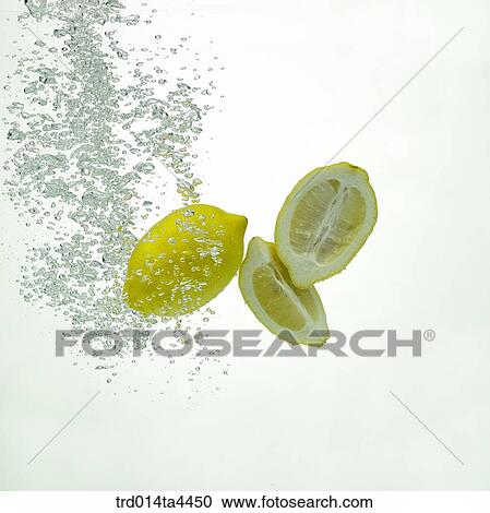 Many lemons in water View Large Photo Image Stock Image - Many lemons in water. Fotosearch