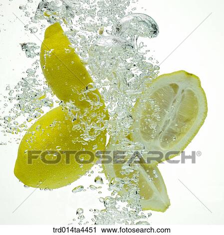 Many lemons in water View Large Photo Image Stock Image - Many lemons in water. Fotosearch