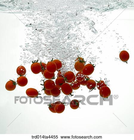 Stock Photography - Tomatoes in water. Fotosearch