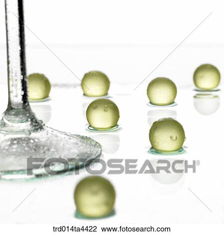 Stock Image - wine glass and many beads. Fotosearch