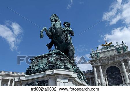 Stock Image - A stutue in front of a museum. Fotosearch