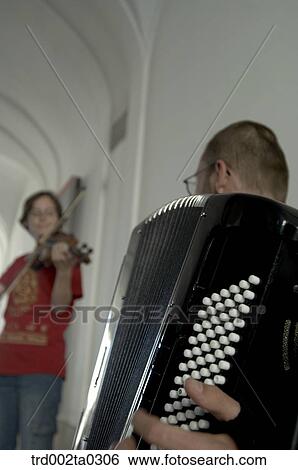Musicians performing at a street View Large Photo Image Stock Photograph - Musicians performing at a street. Fotosearch