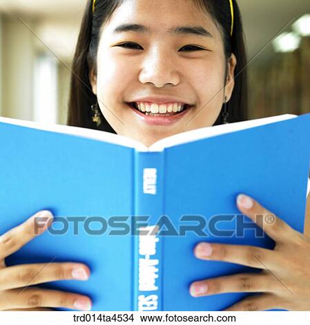 A girl studying in the library View Large Photo Image Picture - A girl studying in the library. Fotosearch