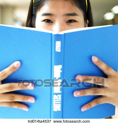A girl studying in the library View Large Photo Image Stock Photo - A girl studying in the library. Fotosearch