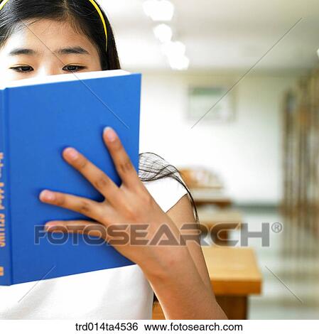 A girl studying in the library View Large Photo Image Stock Photograph - A girl studying in the library. Fotosearch