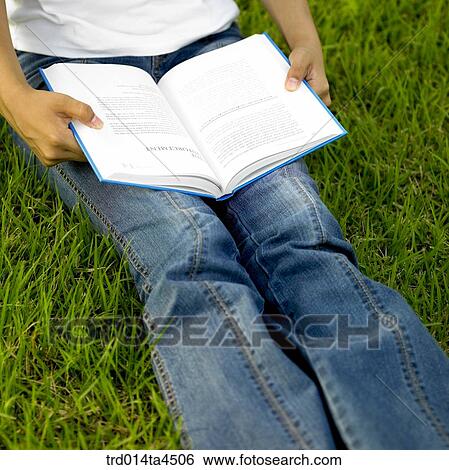 Legs on the grass View Large Photo Image Stock Photograph - Legs on the grass. Fotosearch